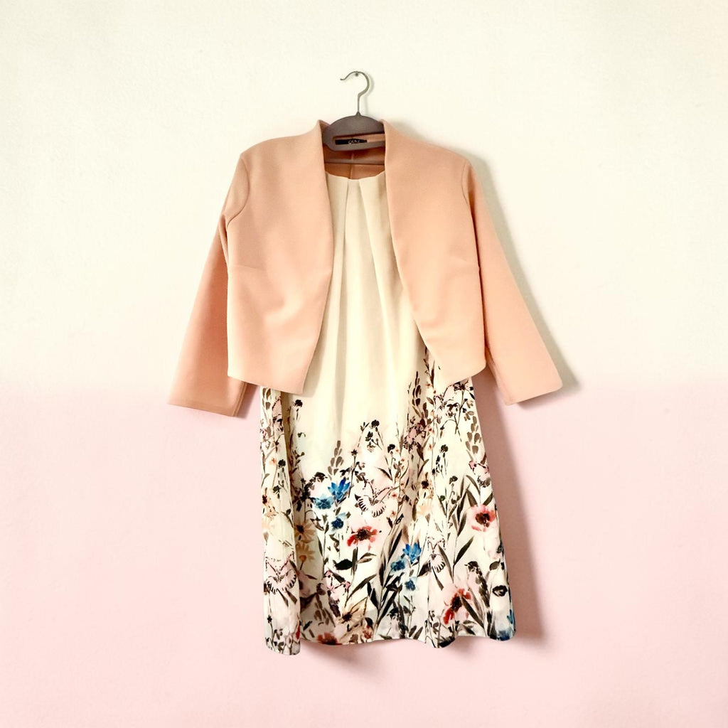 Sleeveless dress with pink jacket