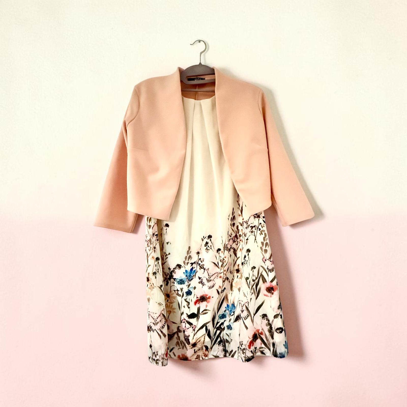 Sleeveless dress with pink jacket