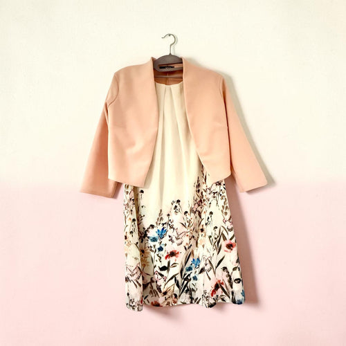 Sleeveless dress with pink jacket