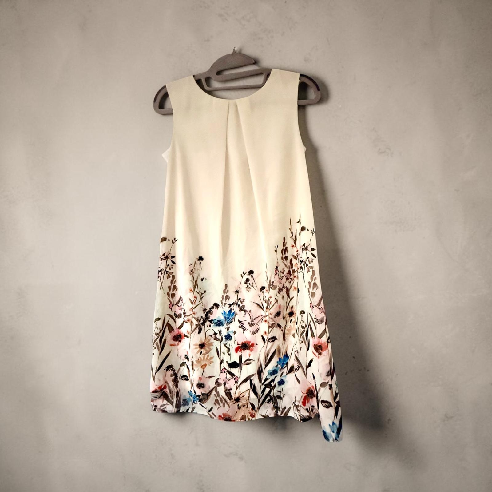 Sleeveless dress with pink jacket