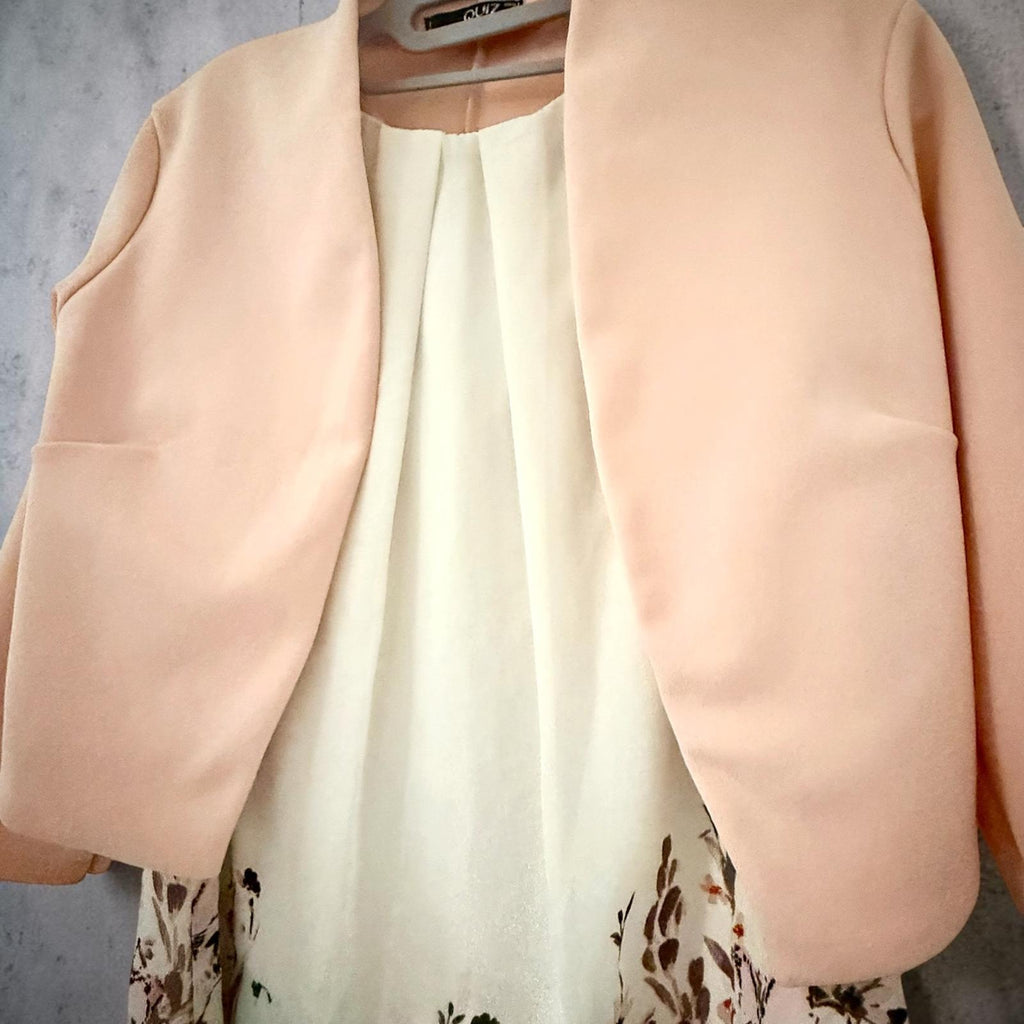 Sleeveless dress with pink jacket